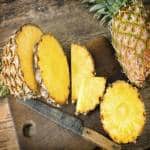 sliced-pineapple-on-chopping-board