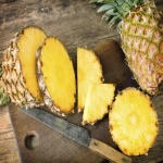 sliced-pineapple-on-chopping-board